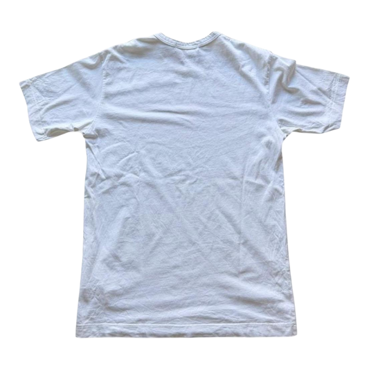Pink and green Comme des Garçons x KAWS graphic T-shirt from The Hennessy Archive, featuring bold artwork on a casual T-shirt.