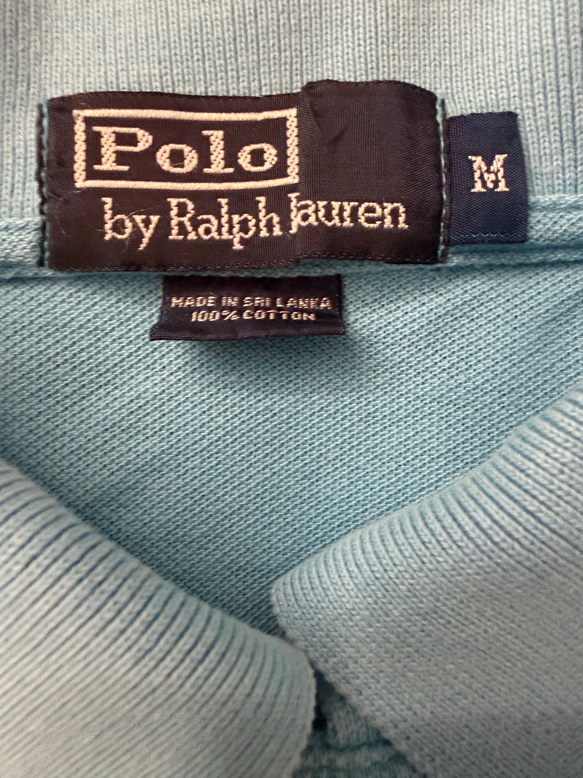Vintage Polo Ralph Lauren men's light blue button-up polo shirt with boxy fit, showcasing classic collar and embroidered logo.