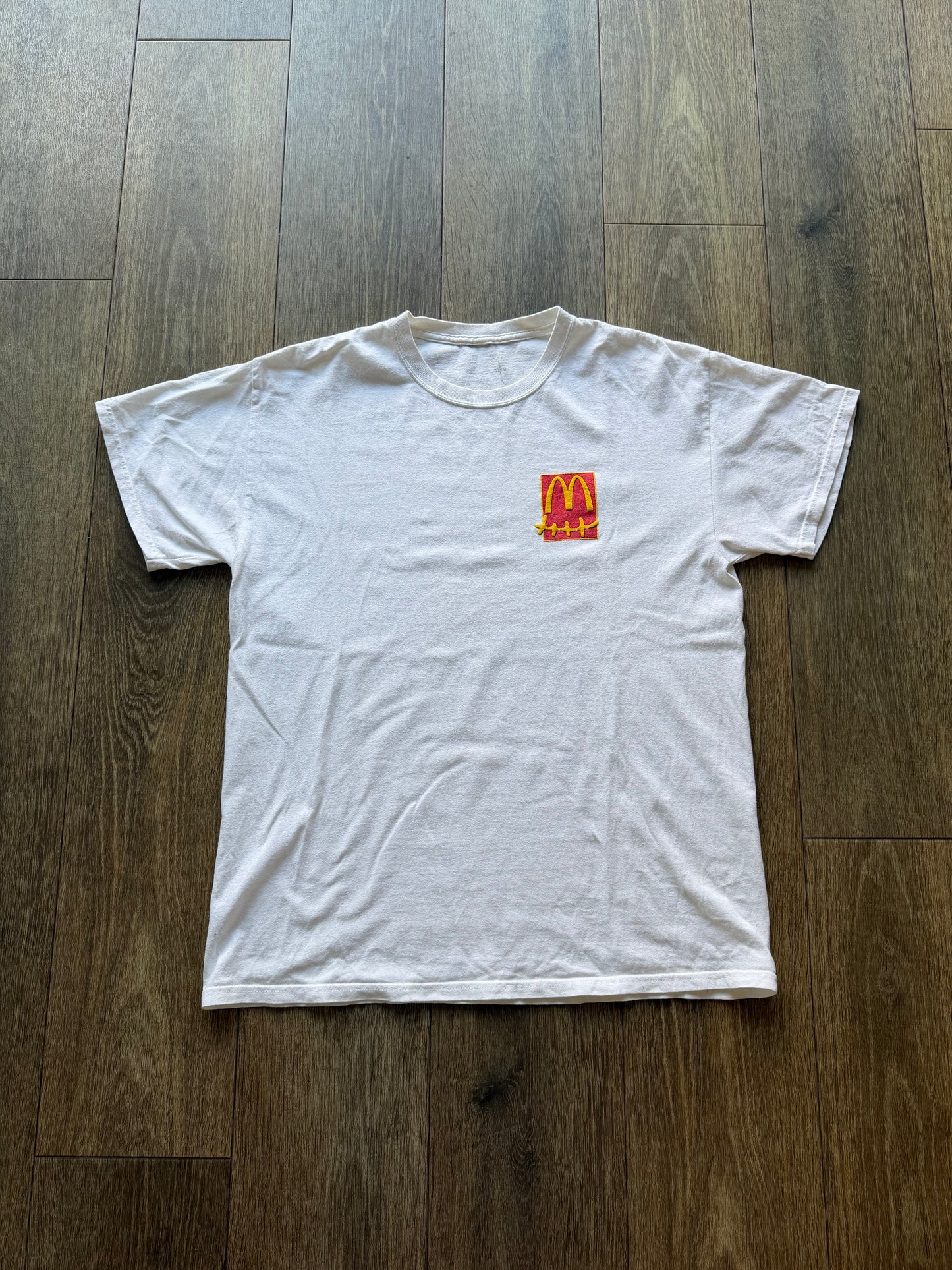 Comme des Garçons x KAWS graphic print T-shirt by The Hennessy Archive, featuring bold artwork on a casual T-shirt.