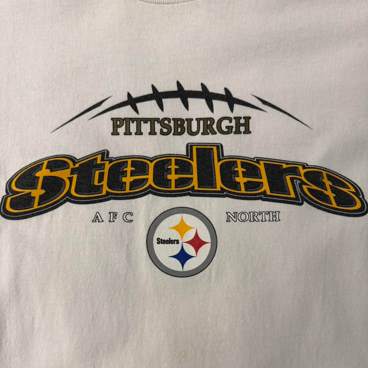 Vintage Pittsburgh Steelers NFL T-shirt with front print logo from the 2000s, featuring The Hennessy Archive branding.