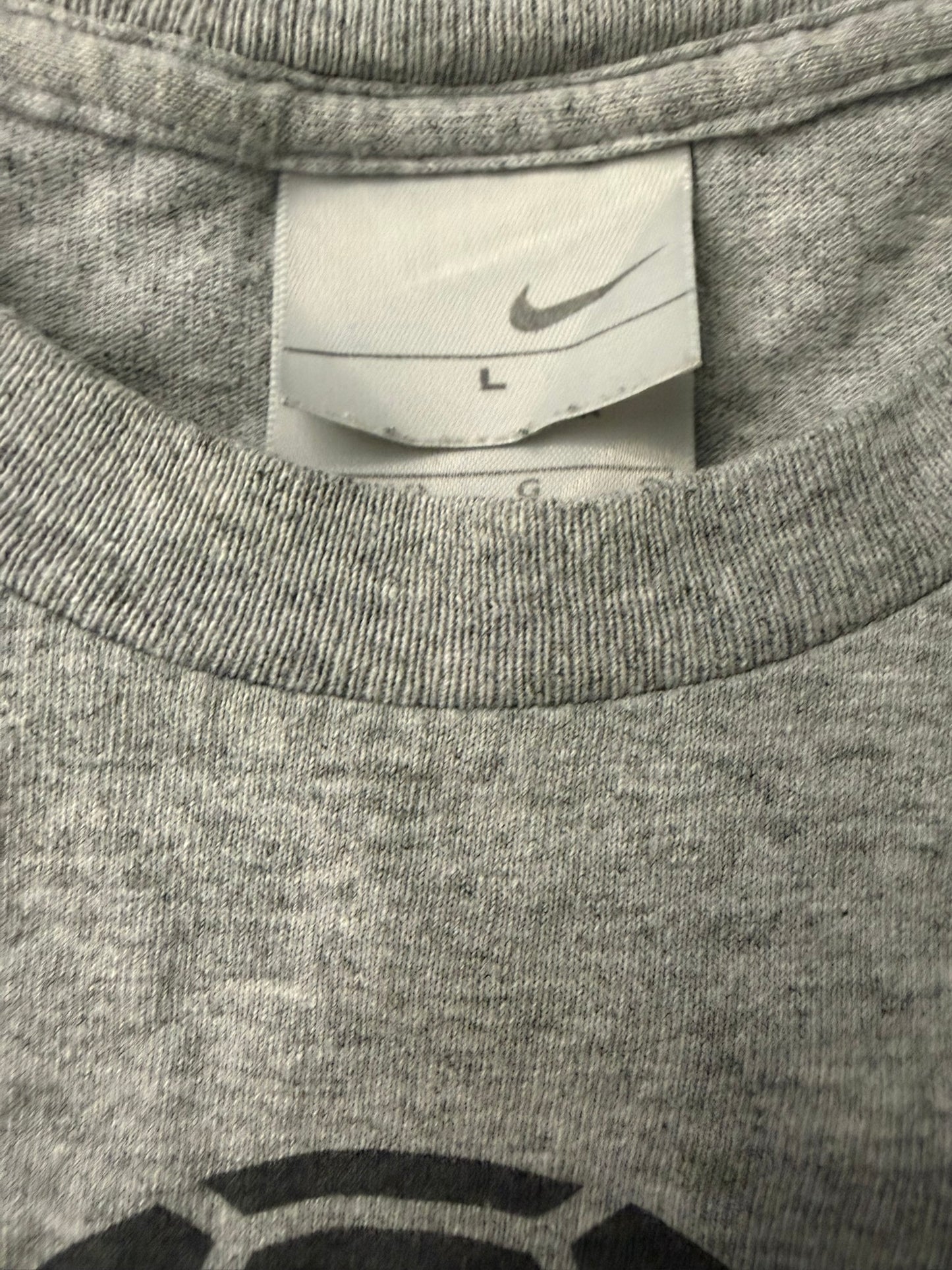 Vintage Nike soccer T-shirt in grey from the 2000s, featuring classic Y2K style, branded by The Hennessy Archive.