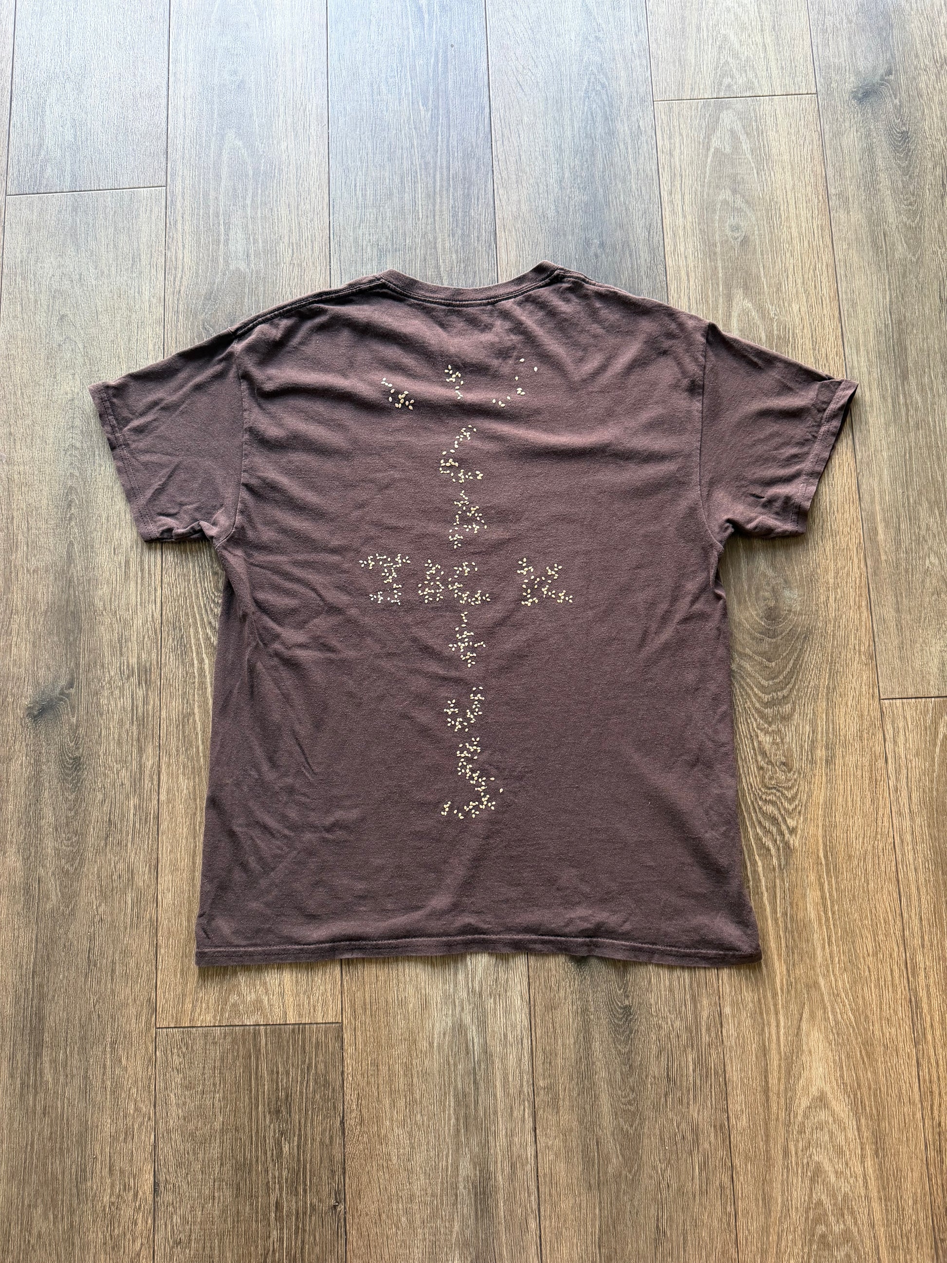 Comme des Garçons x KAWS graphic print T-shirt from The Hennessy Archive, featuring bold artwork on a casual T-shirt.