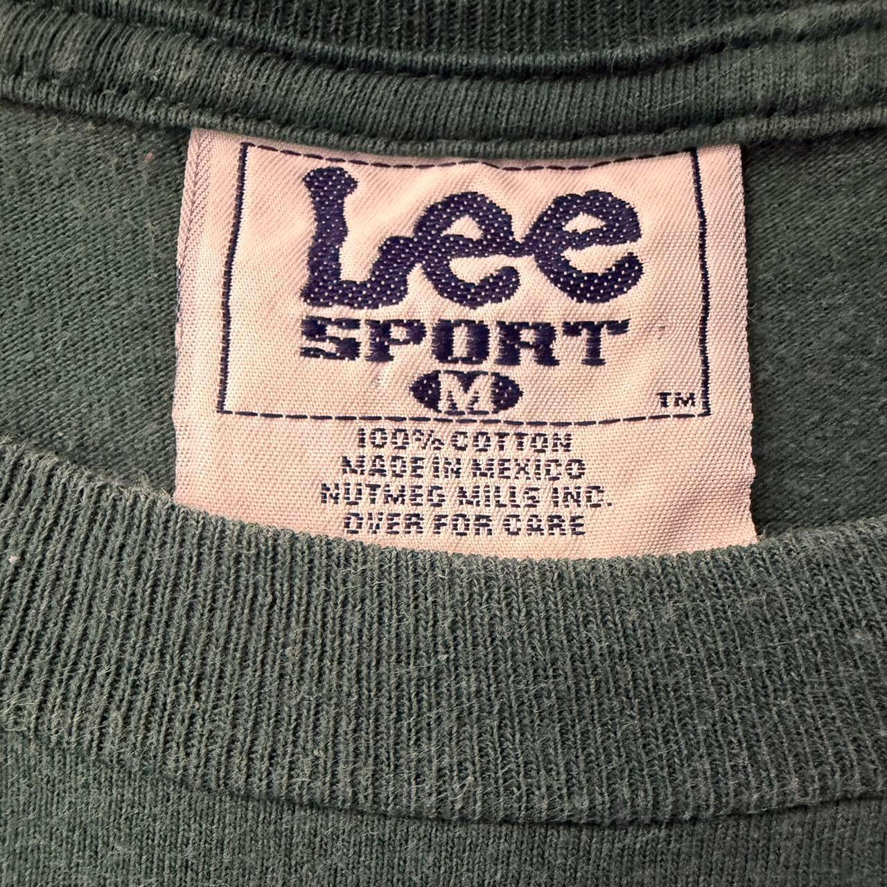 Vintage Green Bay Packers NFL spell-out T-shirt by Lee Sport, 2000s, with green fabric and bold Packers logo design.