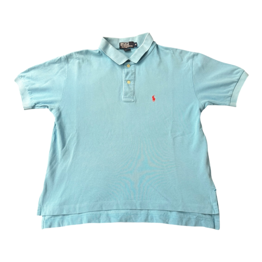 Light blue vintage Polo Ralph Lauren men's button-up polo shirt with boxy fit, displayed on a hanger.