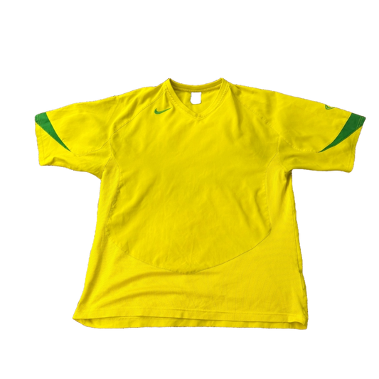 Vintage Nike T90 Yellow Brasil football T-shirt from the 2000s, featuring classic Brazil team design and Nike branding.